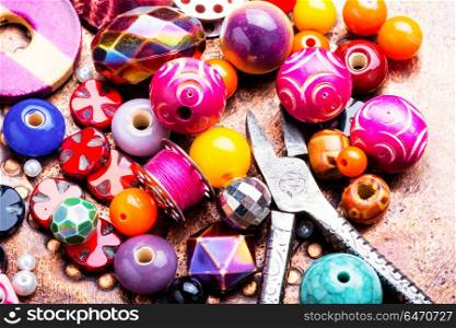 Making jewelry of beads. Beads, colorful beads and tools for needlework.Fashion beads