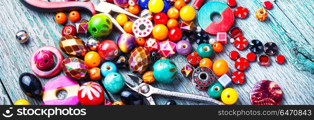 Making jewelry of beads. Beads, colorful beads and tools for needlework.Fashion beads