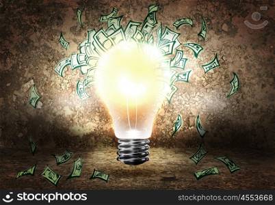 Making money. Conceptual image of light bulb and dollar banknotes