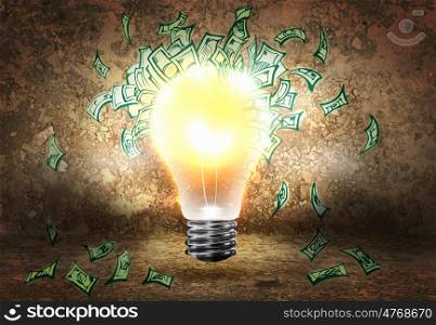 Making money. Conceptual image of light bulb and dollar banknotes