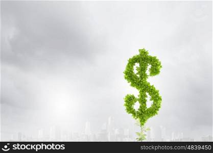 Making money. Conceptual image of plant shaped like dollar sign