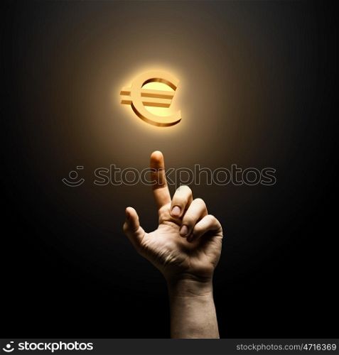 Making money. Human hand pointing at euro symbol. Banking concept
