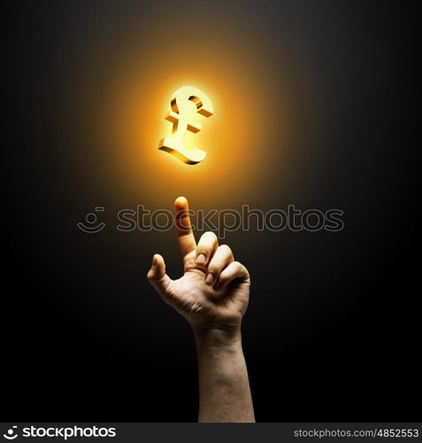 Making money. Human hand pointing at pound symbol. Banking concept