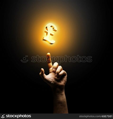Making money. Human hand pointing at pound symbol. Banking concept