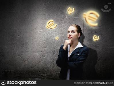 Making money. Image of concentrated businesswoman looking at euro symbol