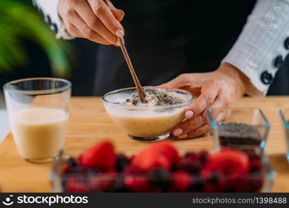 Making Oatmeal with Oats and Soy Milk, Superfood rich in proteins, dietary fibers, minerals and phytonutrients. Making Oatmeal with Oats, Soy Milk and Plant Protein Powder