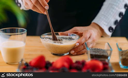 Making Oatmeal with Oats and Soy Milk, Superfood rich in proteins, dietary fibers, minerals and phytonutrients. Making Oatmeal with Oats, Soy Milk and Plant Protein Powder