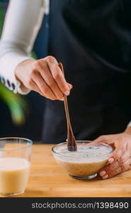 Making Oatmeal with Oats and Soy Milk, Superfood rich in proteins, dietary fibers, minerals and phytonutrients. Making Oatmeal with Oats, Soy Milk and Plant Protein Powder