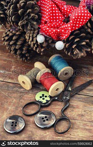 making of Christmas wreath. tools of crafts from buttons and thread for the manufacture of Christmas decoration