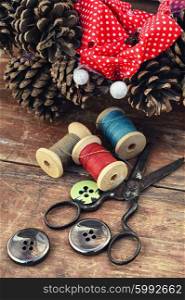 making of Christmas wreath. tools of crafts from buttons and thread for the manufacture of Christmas decoration