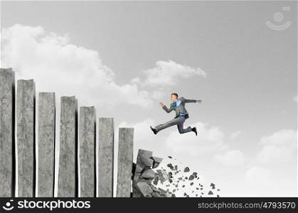Making risky steps. Businessman climbs steps of collapsing financial ladder