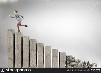 Making risky steps. Businesswoman climbs steps of collapsing finance ladder