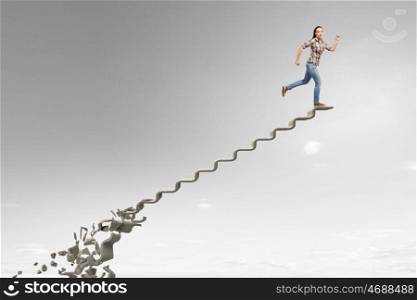 Making risky steps. Businesswoman climbs steps of collapsing finance ladder
