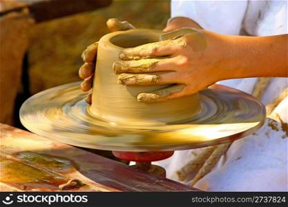 Making the pot on the potter&rsquo;s wheel, closeup