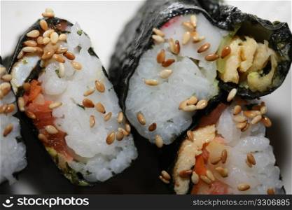 Makisuski, rice and salmon rolled in seaweed