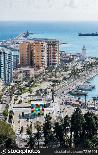 MALAGA - FEBRUARY 20, 2020: Cityscape of Malaga on a cloudy Winter day, with the harbour and some of the main monuments to be recognised.