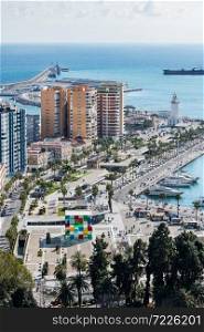MALAGA - FEBRUARY 20, 2020: Cityscape of Malaga on a cloudy Winter day, with the harbour and some of the main monuments to be recognised.