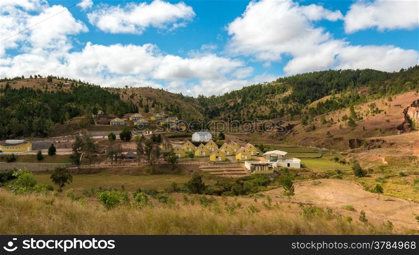 Malagasy homes build along the hills of the central highlands of Madagascar