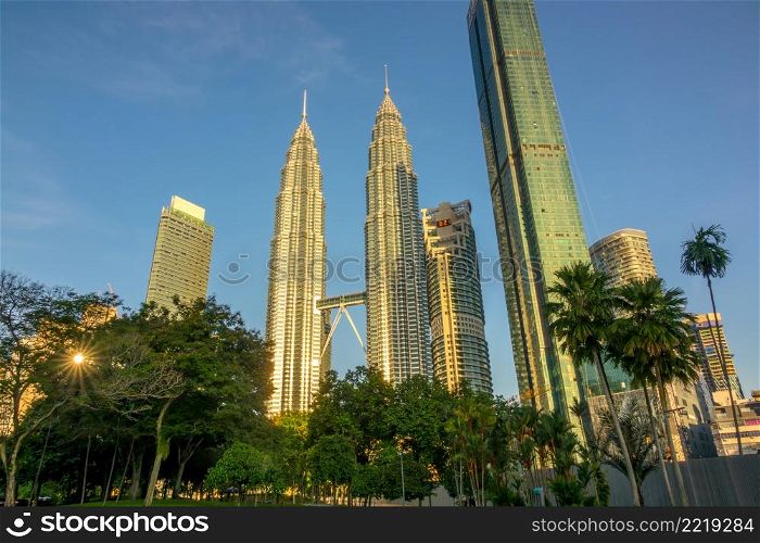 Malaysia, Kuala Lumpur. Morning in the park near Petronas Twin Towers skyscrapers. Morning in the Park near Petronas Twin Towers