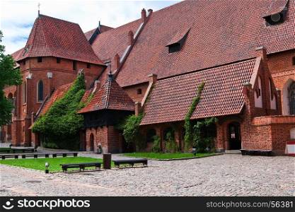 Malbork castle courtyard. Large refectory and the palace chapel of St Catherine. Poland