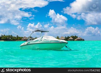 MALDIVES - JUNE 24, 2018: Boat at Tropical beach in the Maldives at summer day