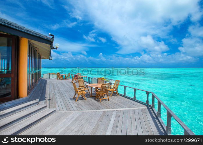 Maldives water bungalow on ocean water landscape