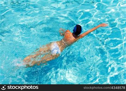 Maldives. Young sports woman swims