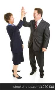 Male and female business people slapping eachother high five. Full body isolated on white.