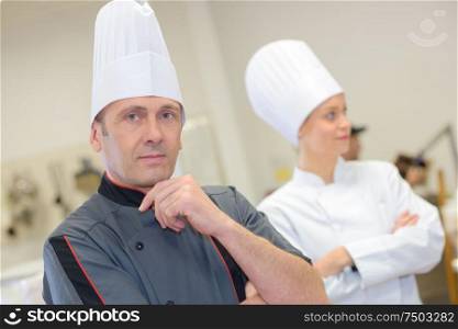 Male and female chefs in uniform