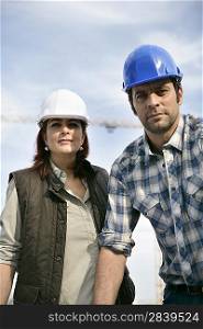 Male and female construction workers