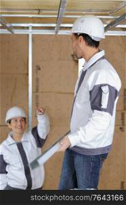 male and female construction workers