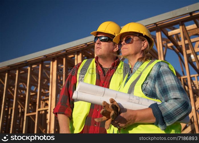 Male and Female Construction Workers at Construction Site.
