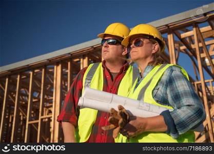 Male and Female Construction Workers at Construction Site.