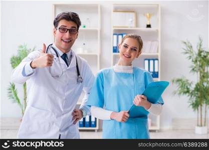 Male and female doctor having discussion in hospital