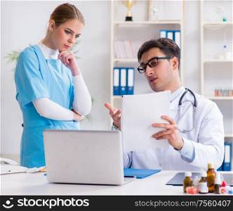 Male and female doctor having discussion in hospital. The male and female doctor having discussion in hospital
