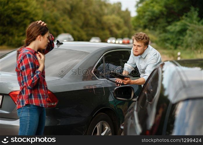 Male and female drivers on road, car accident. Automobile crash. Broken automobile or damaged vehicle, auto collision on highway