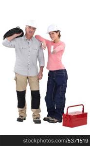 Male and female electricians