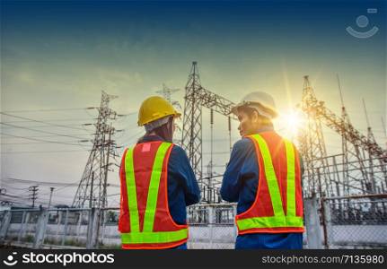 Male and female engineer standing and talking plan for working Power plant development