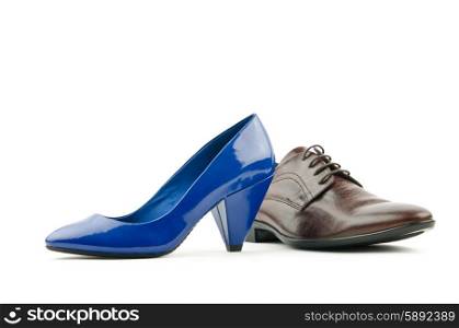 Male and female shoes on white
