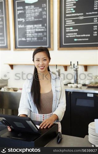 Male And Female Staff In Coffee Shop