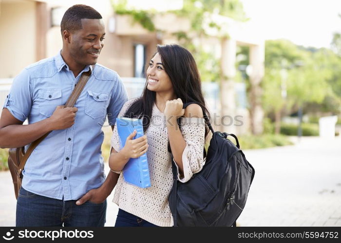 Male And Female University Students Outdoors On Campus