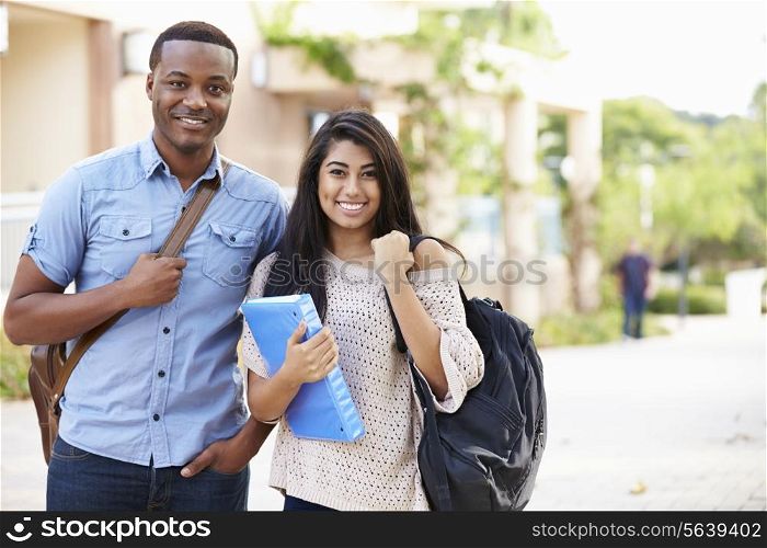 Male And Female University Students Outdoors On Campus