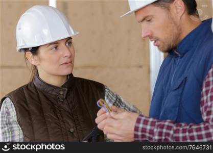 male and female workers at construction site