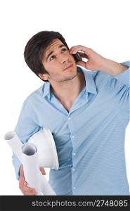 Male architect student with helmet and plans calling with mobile phone on white background