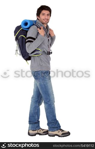 Male backpacker in studio