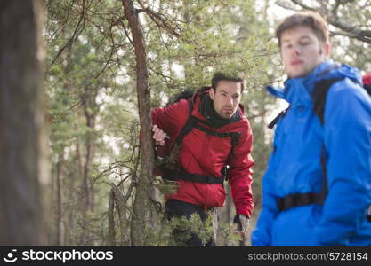 Male backpackers in forest