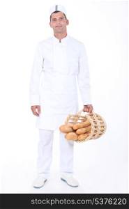 Male bakery worker with basket of bread