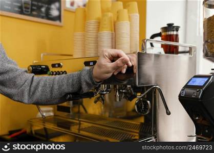 male barista coffee shop coffee grinder