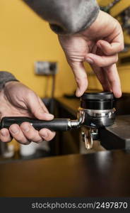 male barista using professional coffee machine cup