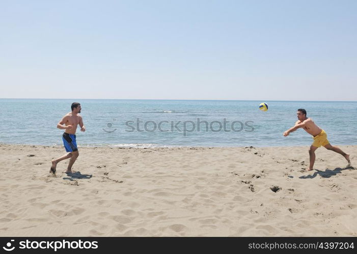 male beach volleyball game player jump on hot sand